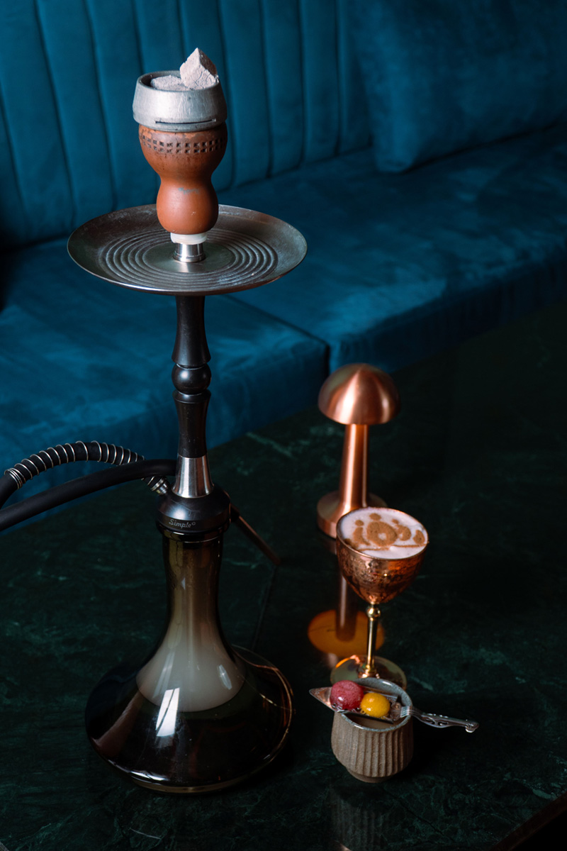 Shisha and cocktails on a marbled table at Queen’s Tandoor Indian Restaurant Bali